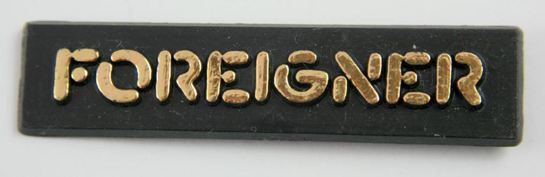Foreigner - 'Gold Logo' Plastic Badge