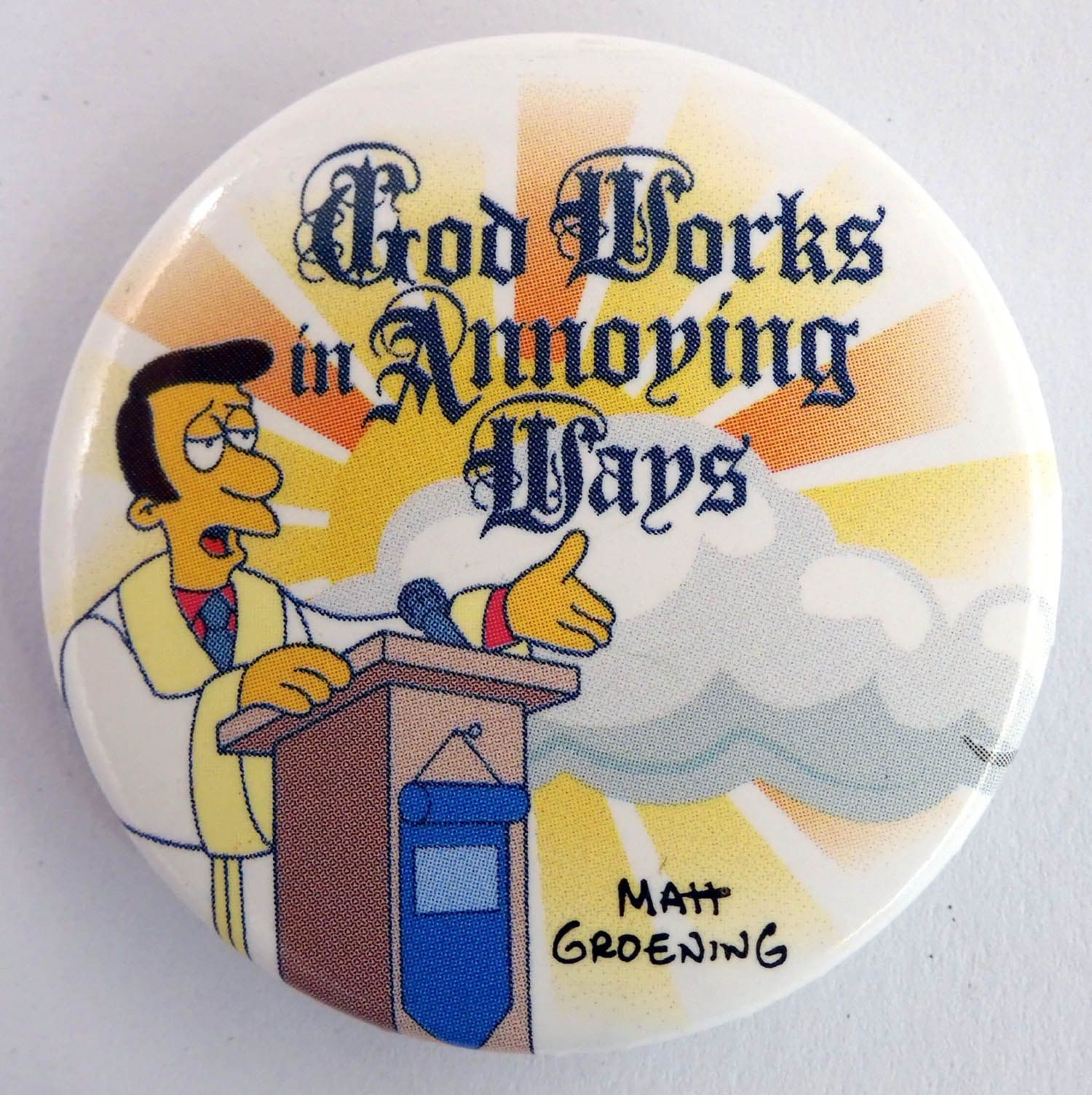 The Simpsons - 'God Works in Annoying Ways' Large Button Badge